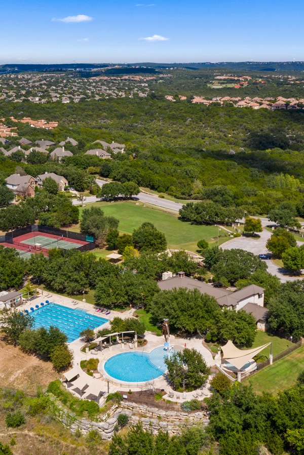 Aerial view of Austin TX suburbs with swimming pools